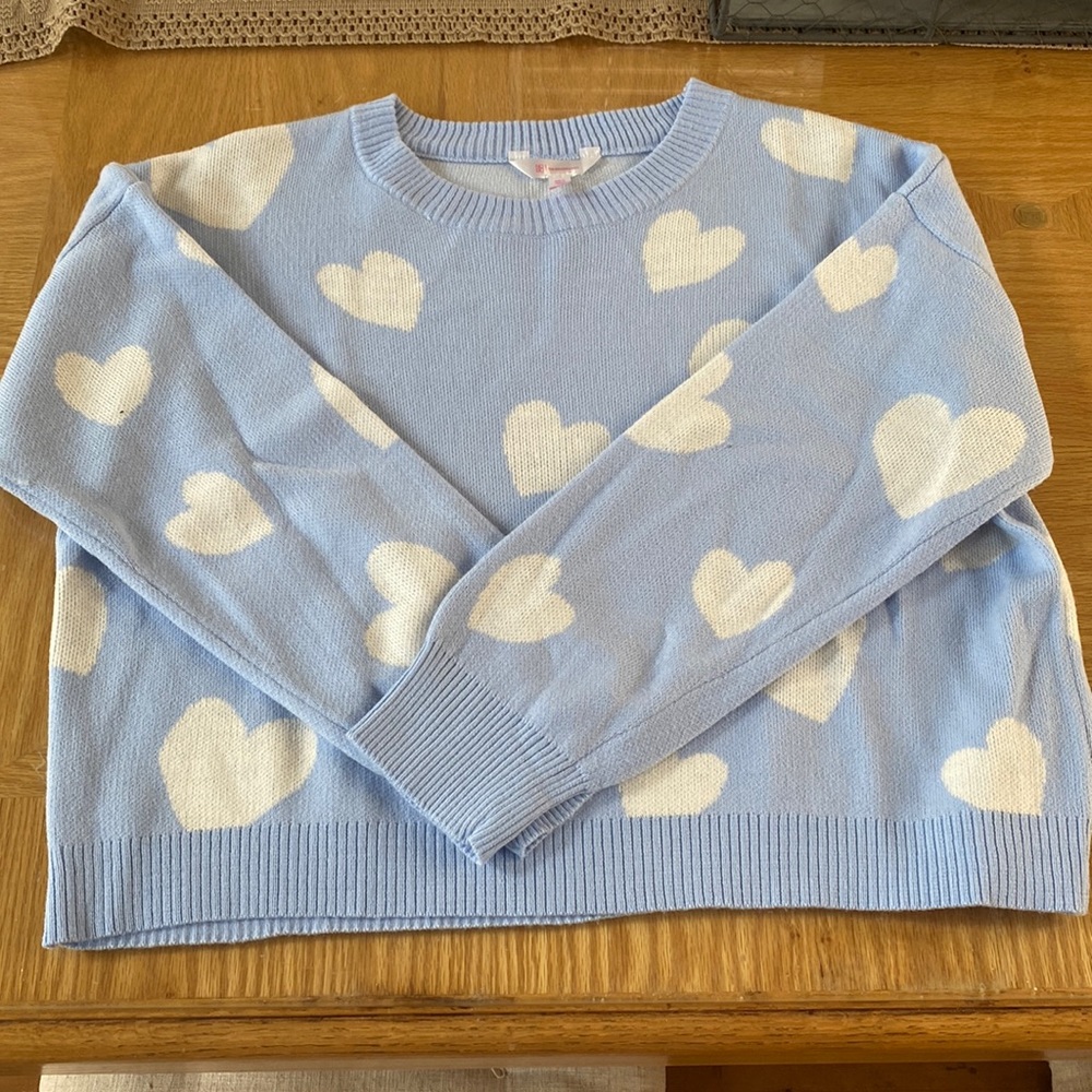 Blue sweater with white hearts